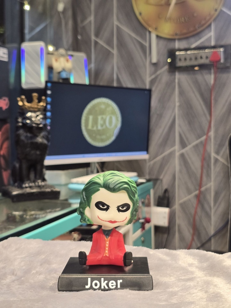 Joker Figurine with Iconic Green Hair and Red Suit